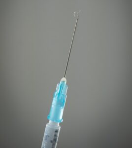 blue and white lollipop on white surface